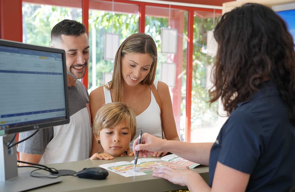 Family checking into hotel